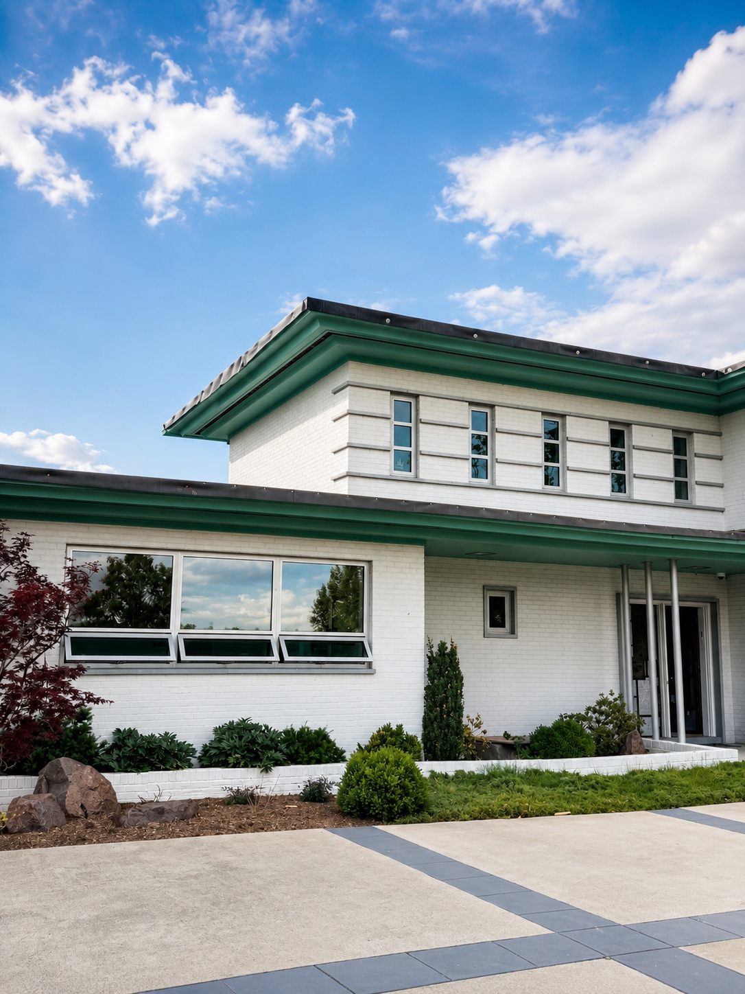 Home with silver Arcadia aluminum windows